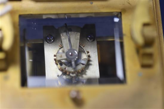 An early 20th century ormolu and porcelain hour repeating carriage clock, 6.5in., with travelling case